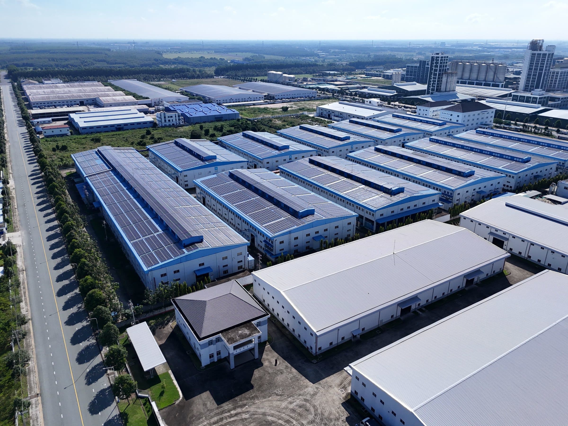 Aerial view of an industrial estate with solar panels on its factory roofs in Bình Dương, Vietnam.